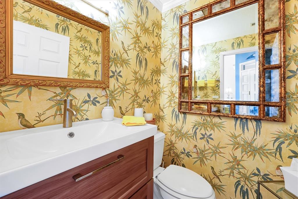 139 Woden Way Winter Haven, FL 33884 - Photo 15 of 60 a bathroom with a sink a toilet and a shower curtain