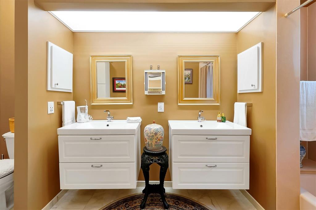 139 Woden Way Winter Haven, FL 33884 - Photo 18 of 60 a bathroom with a sink a toilet and mirror