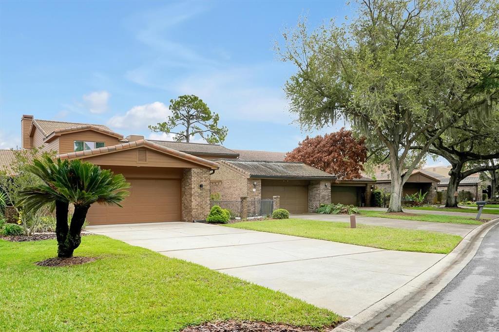 139 Woden Way Winter Haven, FL 33884 - Photo 2 of 60 a house with garden in front of it