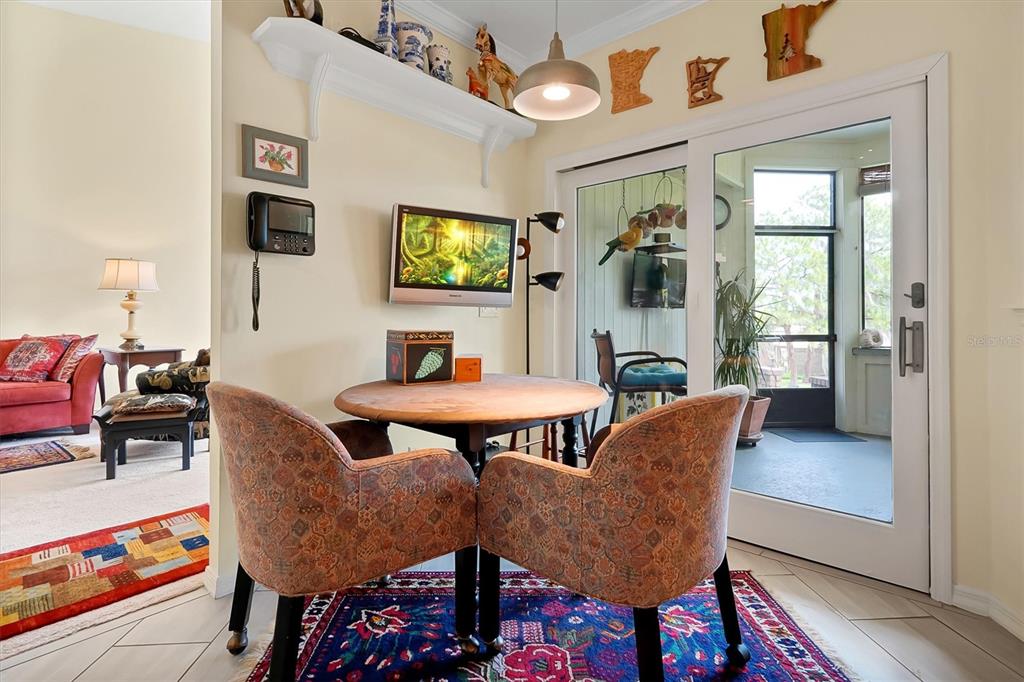 139 Woden Way Winter Haven, FL 33884 - Photo 25 of 60 a view of a dining room with furniture and wooden floor