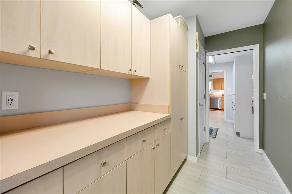 139 Woden Way Winter Haven, FL 33884 - Photo 26 of 60 a view of a kitchen with white cabinets