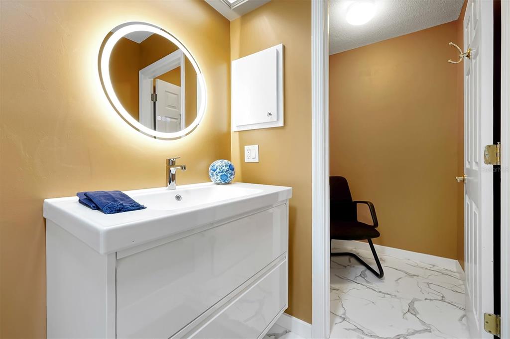 139 Woden Way Winter Haven, FL 33884 - Photo 31 of 60 a bathroom with a sink and a mirror