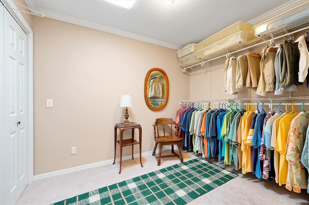 139 Woden Way Winter Haven, FL 33884 - Photo 33 of 60 a view of walk in closet with clothes and shoes