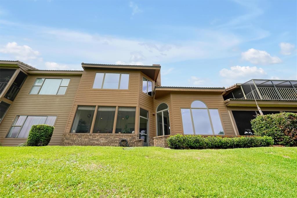139 Woden Way Winter Haven, FL 33884 - Photo 44 of 60 a front view of a house with a yard