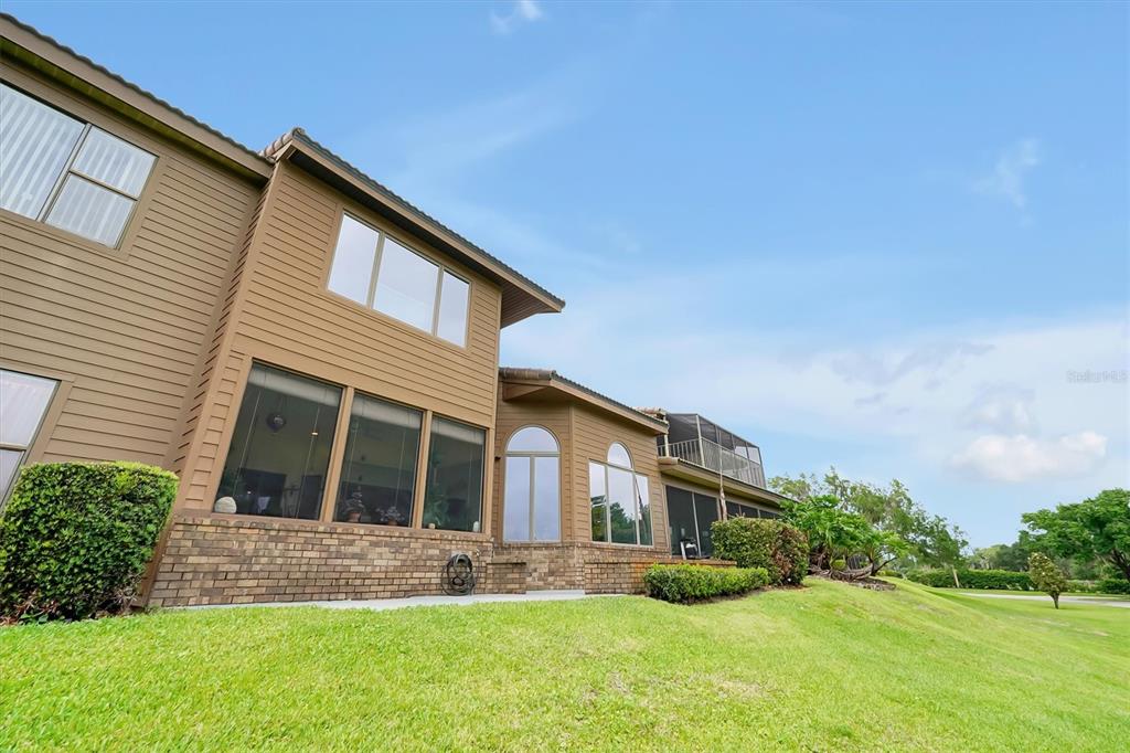 139 Woden Way Winter Haven, FL 33884 - Photo 45 of 60 a front view of house with yard and green space