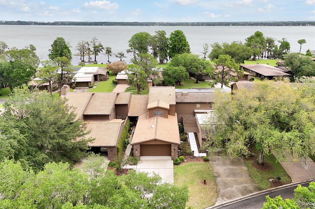 139 Woden Way Winter Haven, FL 33884 - Photo 47 of 60 an aerial view of residential houses with outdoor space and lake view