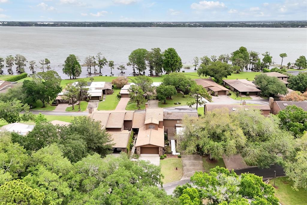 139 Woden Way Winter Haven, FL 33884 - Photo 48 of 60 a aerial view of a house with a yard and lake view