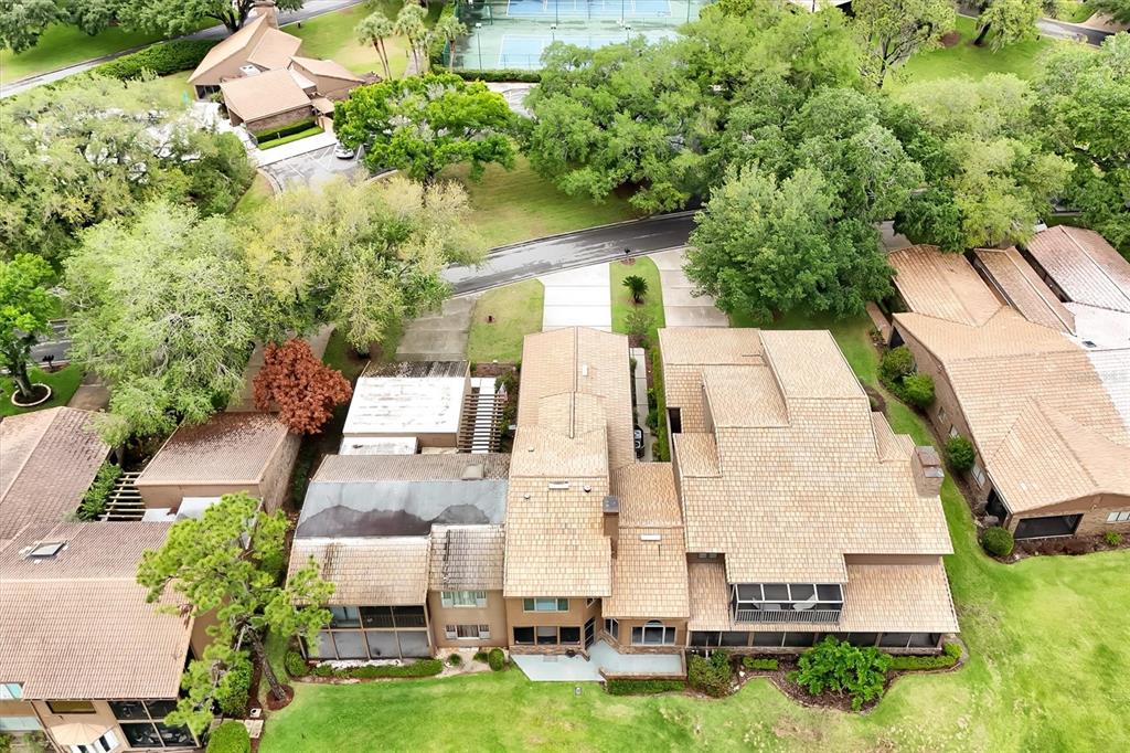 139 Woden Way Winter Haven, FL 33884 - Photo 50 of 60 an aerial view of multiple houses with yard