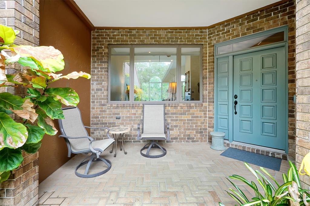 139 Woden Way Winter Haven, FL 33884 - Photo 5 of 60 a view of a door and chair in a patio