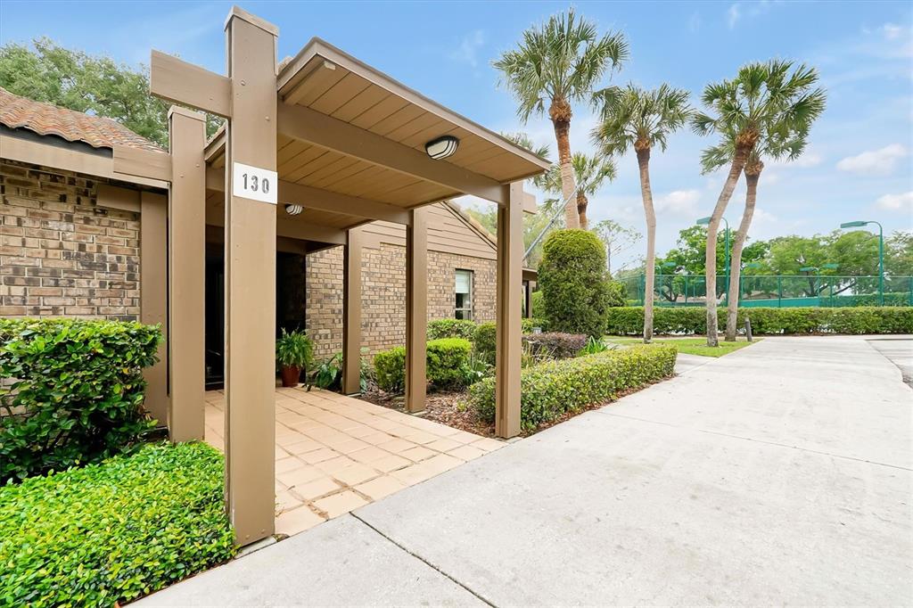 139 Woden Way Winter Haven, FL 33884 - Photo 51 of 60 a view of a house with a yard and potted plants