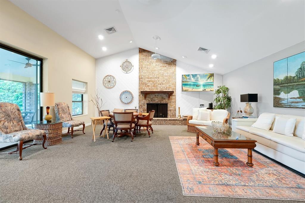 139 Woden Way Winter Haven, FL 33884 - Photo 52 of 60 a living room with fireplace furniture and a large window