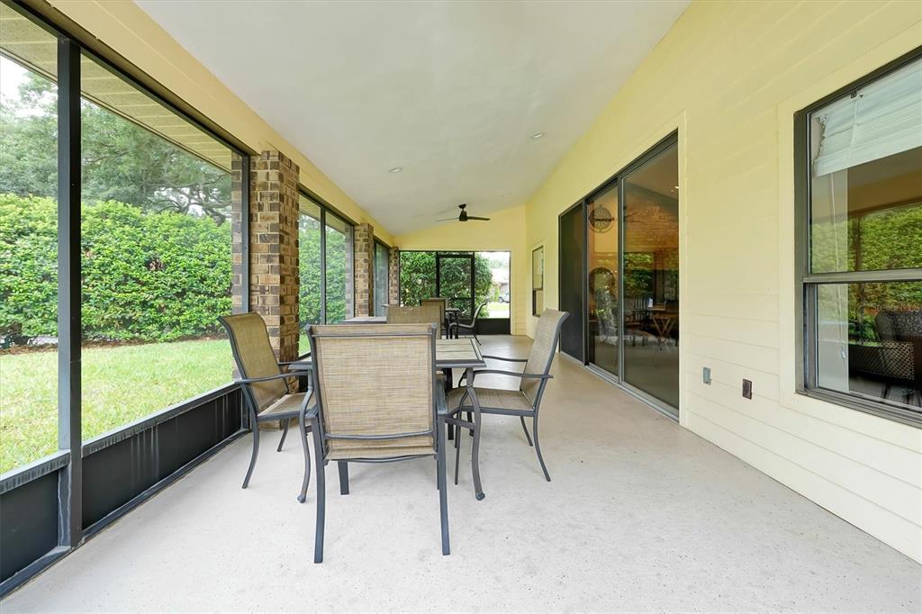 139 Woden Way Winter Haven, FL 33884 - Photo 55 of 60 a dining room with furniture and a floor to ceiling window