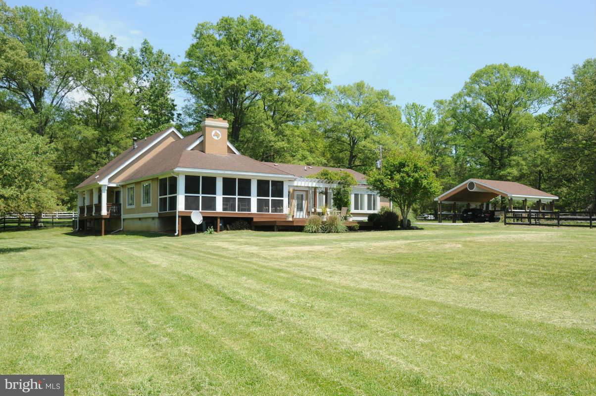 16311 Accolawn Road Accokeek, MD 20607 - Photo 2 of 17 a front view of a house with a garden