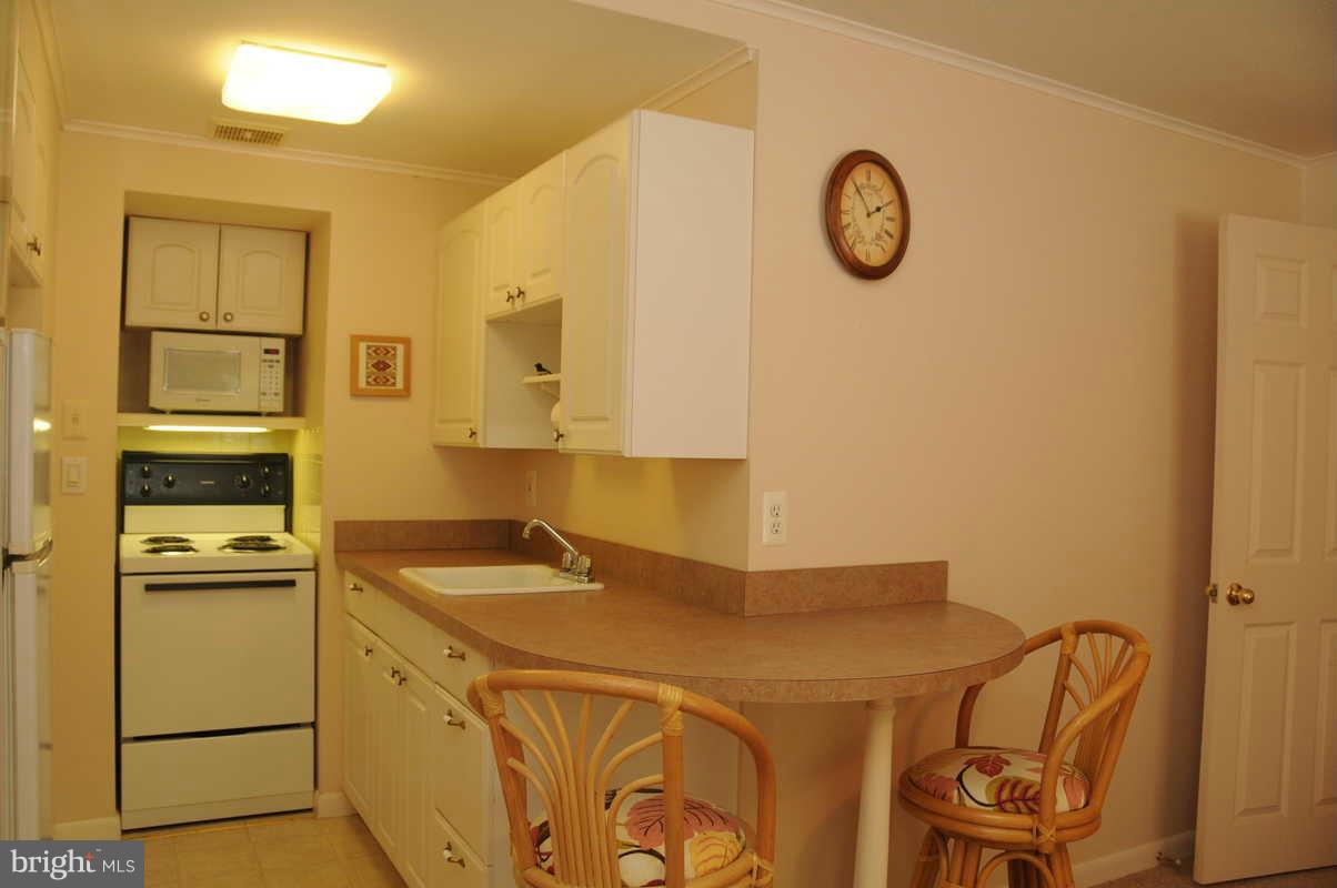 16311 Accolawn Road Accokeek, MD 20607 - Photo 11 of 17 a kitchen with a sink and cabinets
