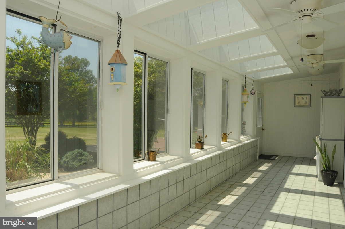 16311 Accolawn Road Accokeek, MD 20607 - Photo 16 of 17 a bathroom with a tub shower and sink