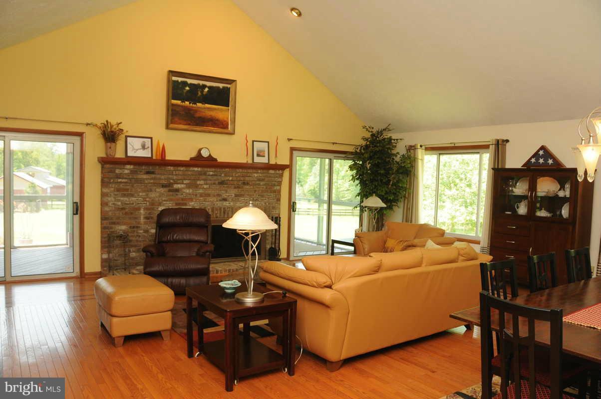16311 Accolawn Road Accokeek, MD 20607 - Photo 4 of 17 a living room with furniture and a fireplace