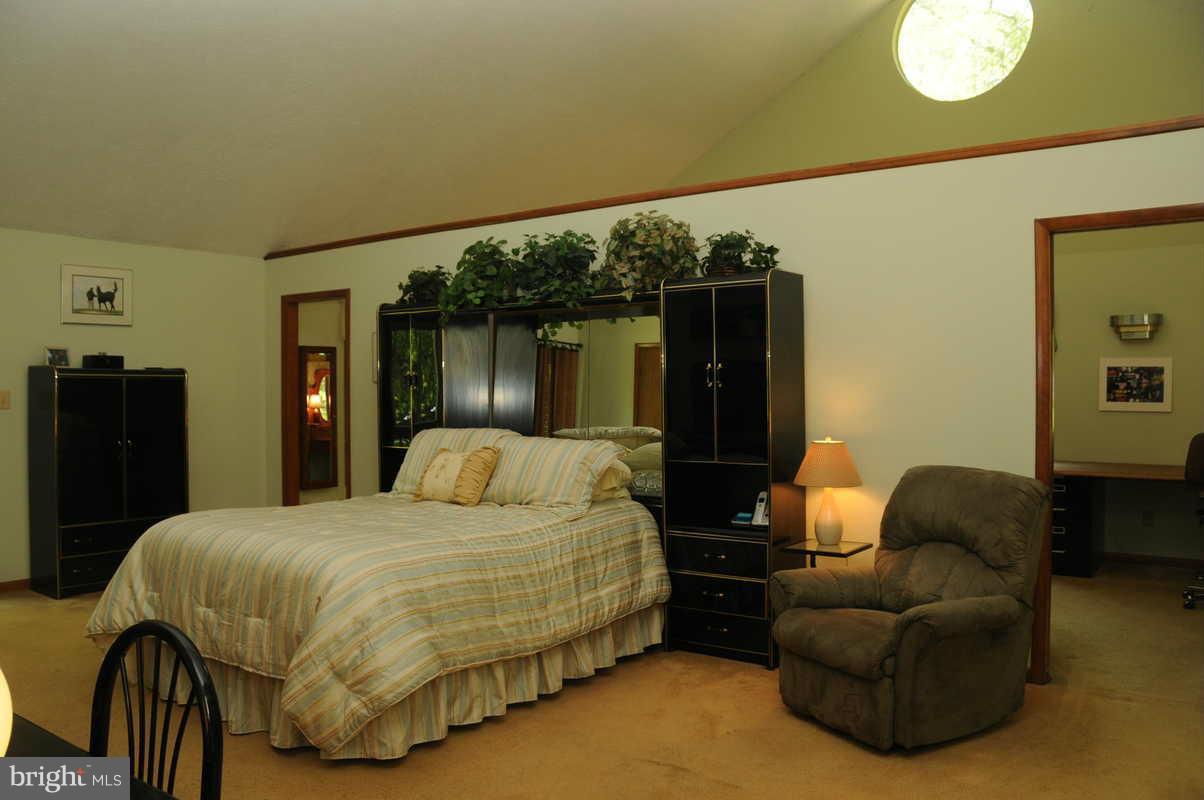 16311 Accolawn Road Accokeek, MD 20607 - Photo 8 of 17 a bedroom with a bed window and dresser