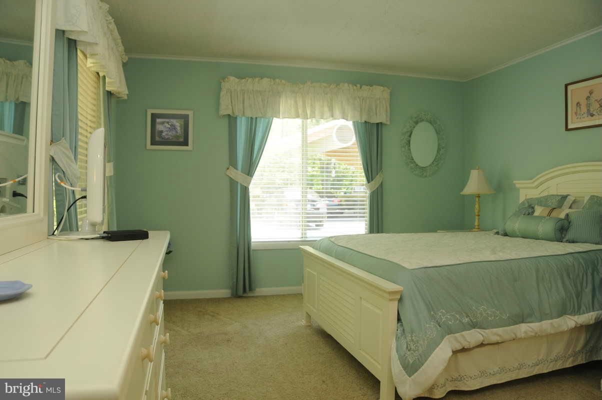 16311 Accolawn Road Accokeek, MD 20607 - Photo 10 of 17 a bedroom with a bed and a window