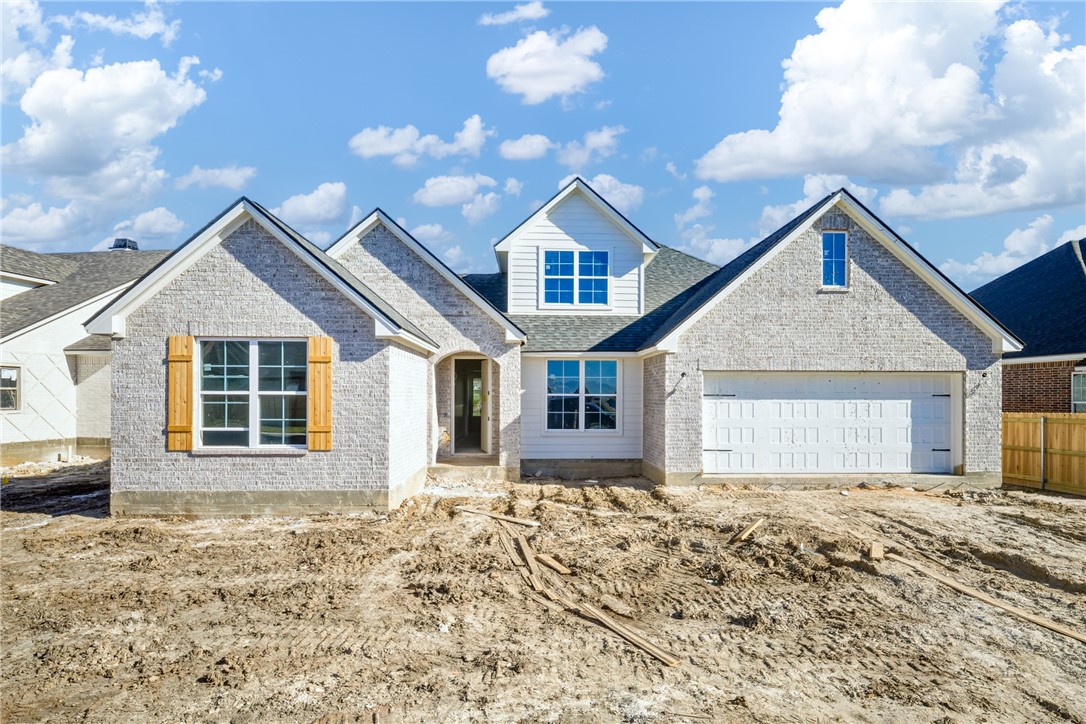 Front Elevation: Brick and siding.