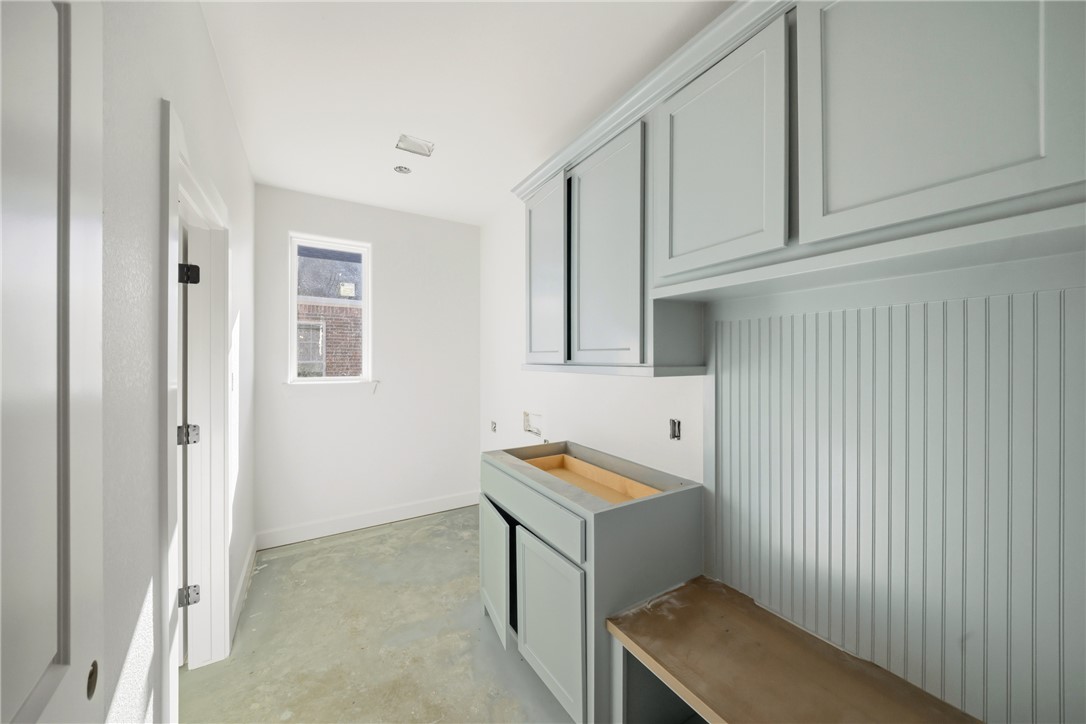 5103 Booth Falls Trail Bryan, TX 77802 - Photo 12 of 18 Large Laundry room and mud room combination featuring a stained bench top and storage.
