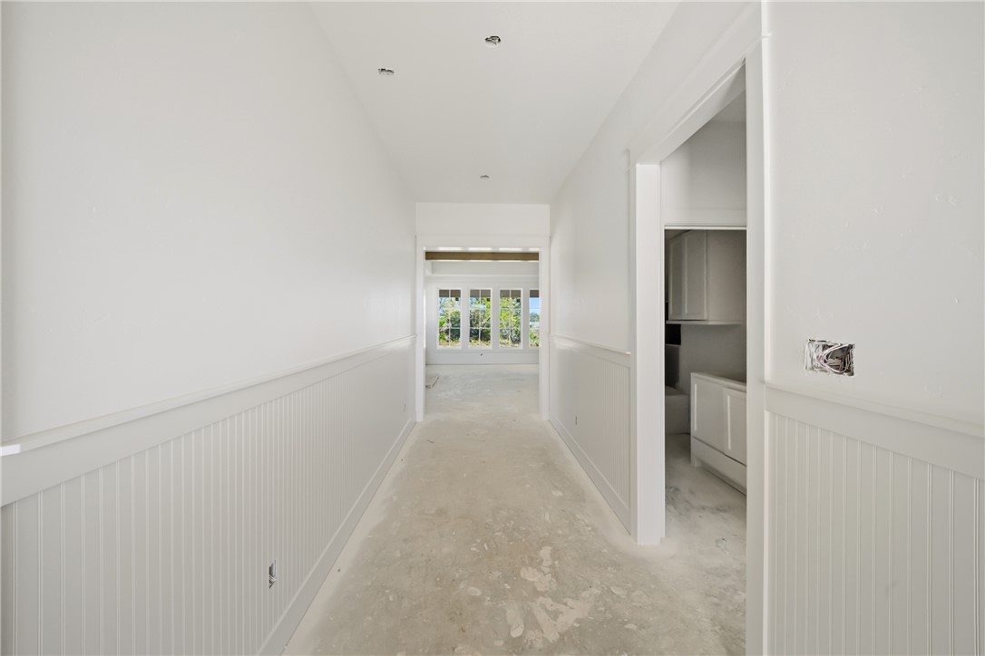 5103 Booth Falls Trail Bryan, TX 77802 - Photo 3 of 18 Foyer showing trim wainscoat leading into the main area.