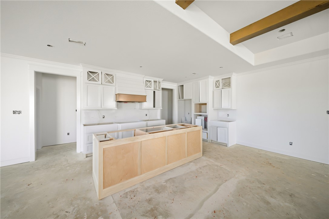 5103 Booth Falls Trail Bryan, TX 77802 - Photo 7 of 18 View of Kitchen with custom cabinets and venthood. One level island.