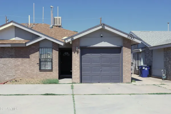 a front view of a house with a garage