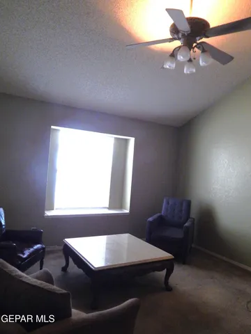 a room with furniture and a window