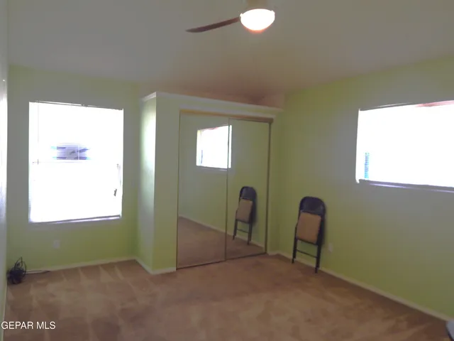 a view of a room with windows