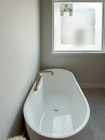 a close view of a bathtub in a bathroom
