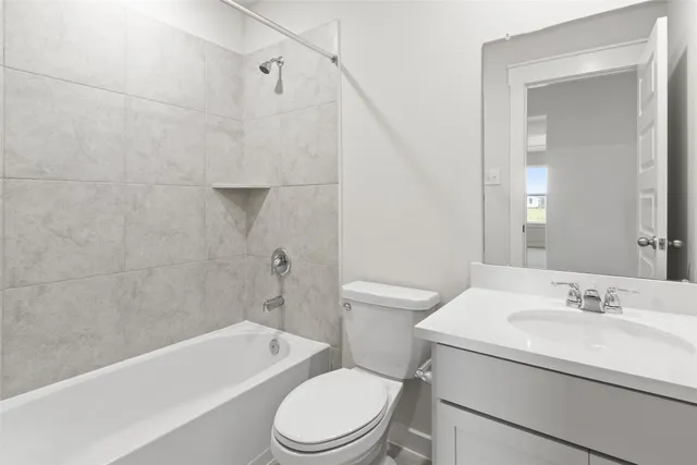 a bathroom with a sink a toilet and a bathtub