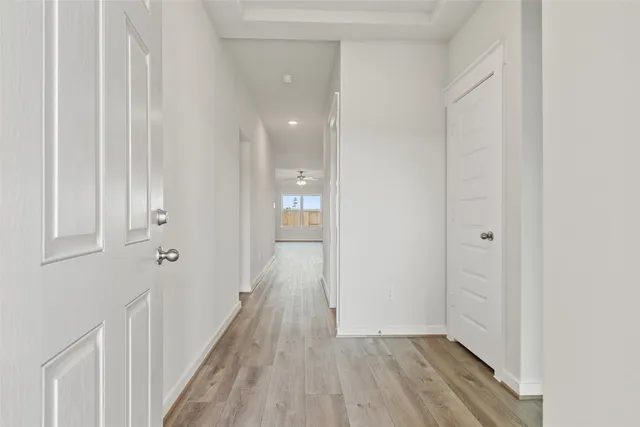 a view of a room with wooden floor