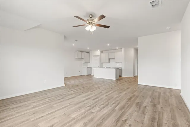 a view of a kitchen with a dishwasher cabinets and wooden floor