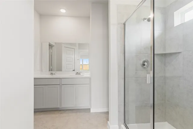 a bathroom with a sink and mirror