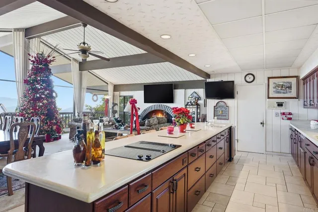 a bed sitting in a spacious bedroom next to a window