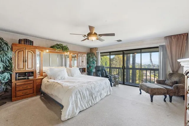 a kitchen with stainless steel appliances granite countertop a refrigerator a stove and a sink with large cabinets