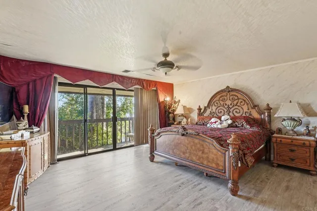 a room with wooden floor and flat screen tv