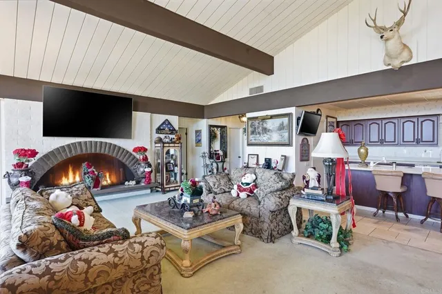 a view of a dining room with furniture chandelier and a table
