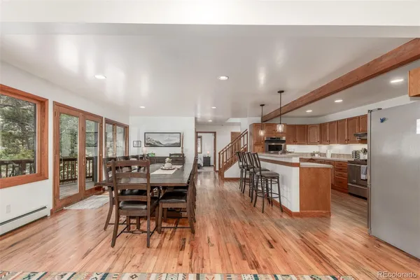 a view of a dining room with furniture window and wooden floor