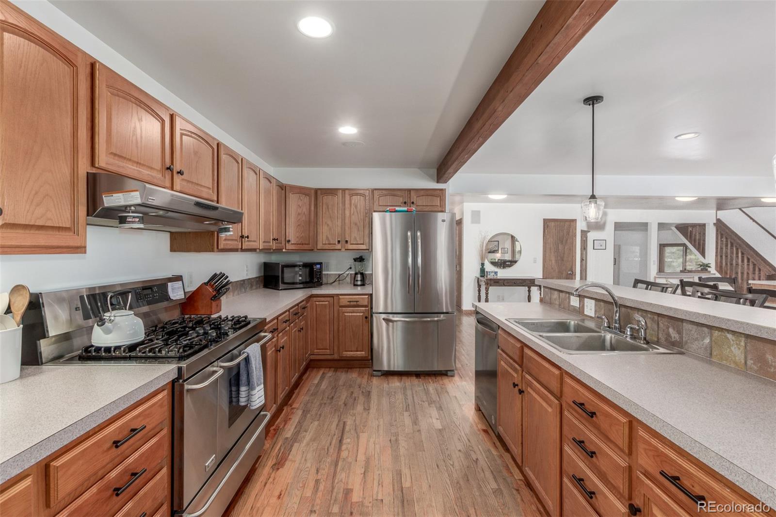 11543 County Road 43 Drake, CO 80515 - Photo 16 of 50 a kitchen with stainless steel appliances granite countertop a sink stove and refrigerator
