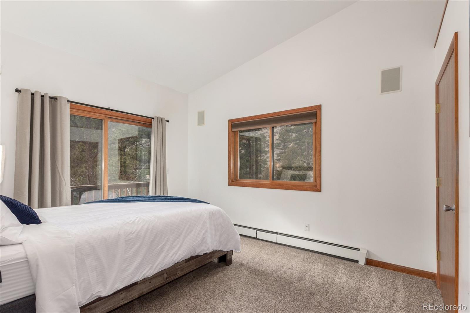 11543 County Road 43 Drake, CO 80515 - Photo 32 of 50 a bedroom with a bed and a large window