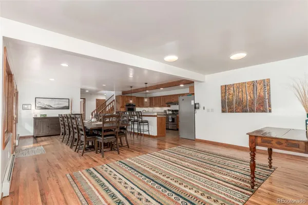 a room with lots of wooden furniture and appliances