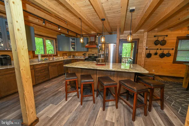 a living room with fireplace furniture and a flat screen tv