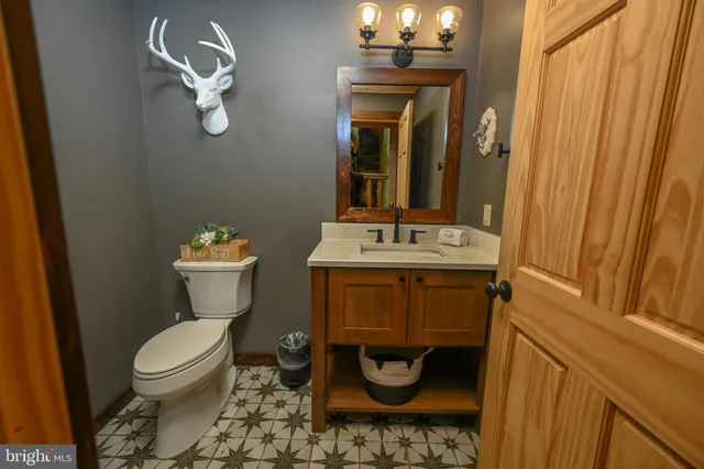 a bedroom with furniture and a flat screen tv