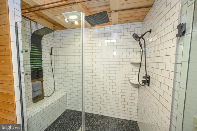 a bedroom with a bed and flat screen tv