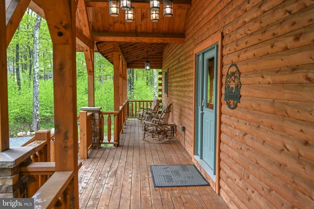 a view of a dinning tables and chairs in the balcony