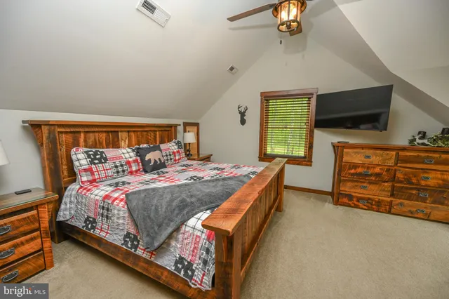 a front view of a house with a yard table and chairs