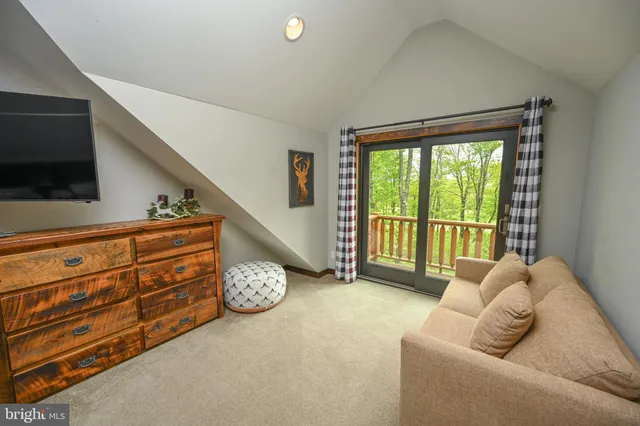 a front view of a house with a yard table and chairs