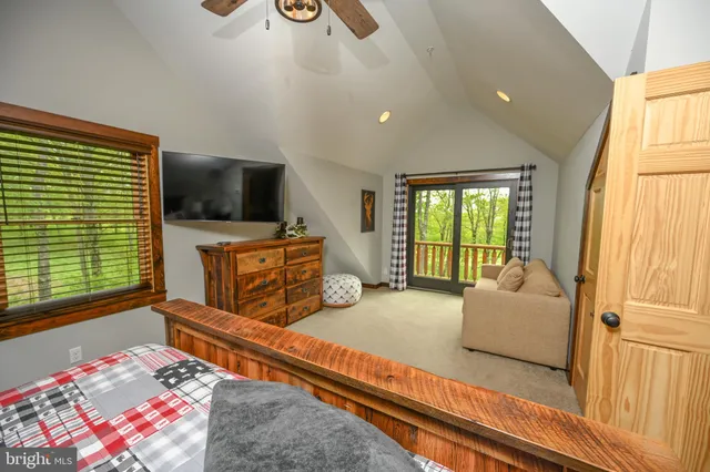 a front view of a house with a yard table and chairs