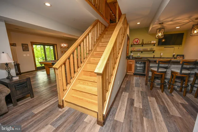 a view of a house with backyard porch and sitting area
